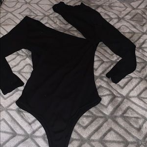 Black crewneck body suite with a slit